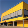 Warema fasadmarkiser på gul fasad